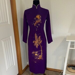 Elegant purple and gold Vietnamese traditional gown (“ao dai”)